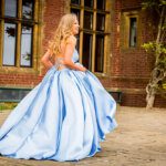 prom goer in a pale blue cinderella style dress