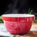 Red bowl with steam rising out of it