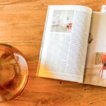 Shot of a magazine and a  brown glass vase from above