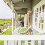 external shot of a holiday cottage and sweeping green landscape