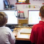 Young  junior school students learning online