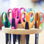 A stack of colourful handled scissors